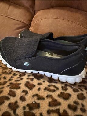 Skechers Women’s Black Slip-On Memory Foam Sneakers with White Sole